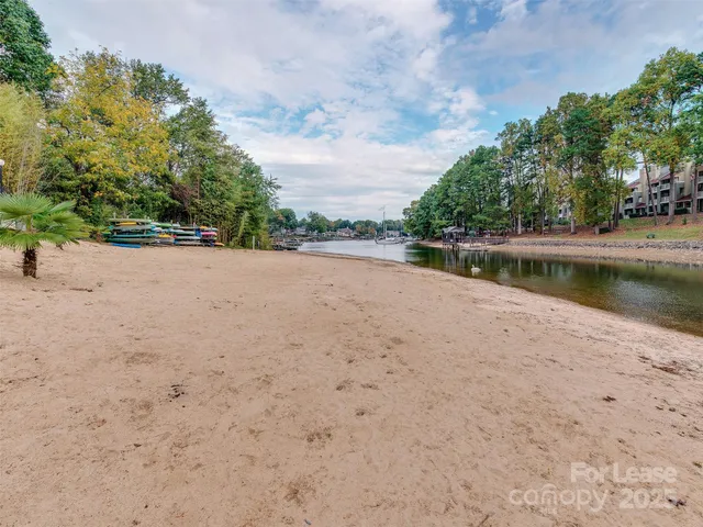 a view of a lake with houses in the background