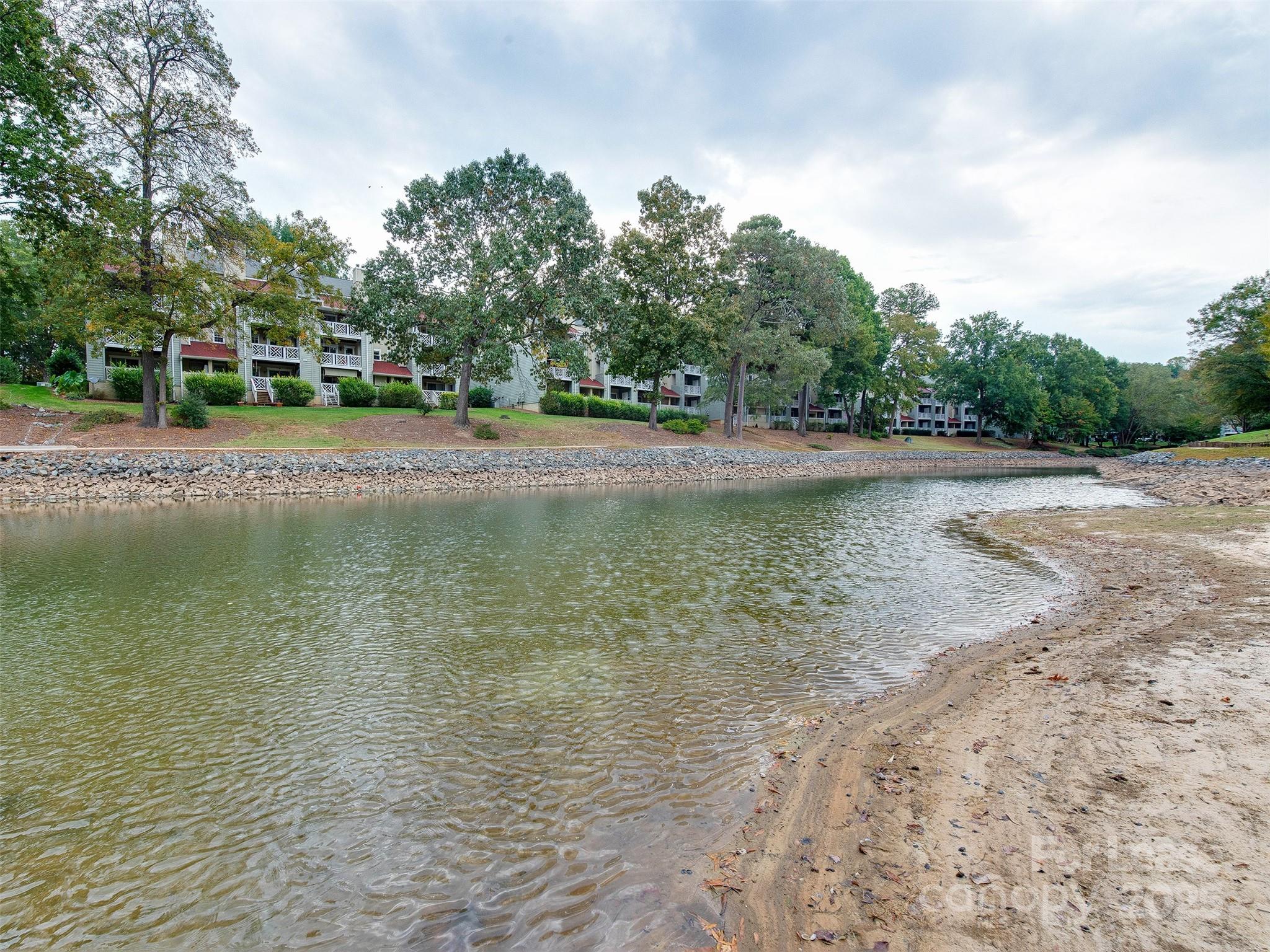 19827 Henderson Road, Unit B Cornelius, NC 28031 - Photo 42 of 48 a view of a lake with houses