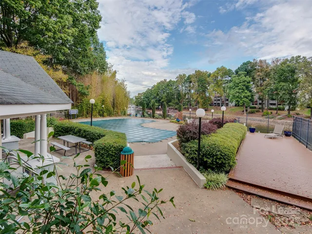 a view of a garden with sitting area