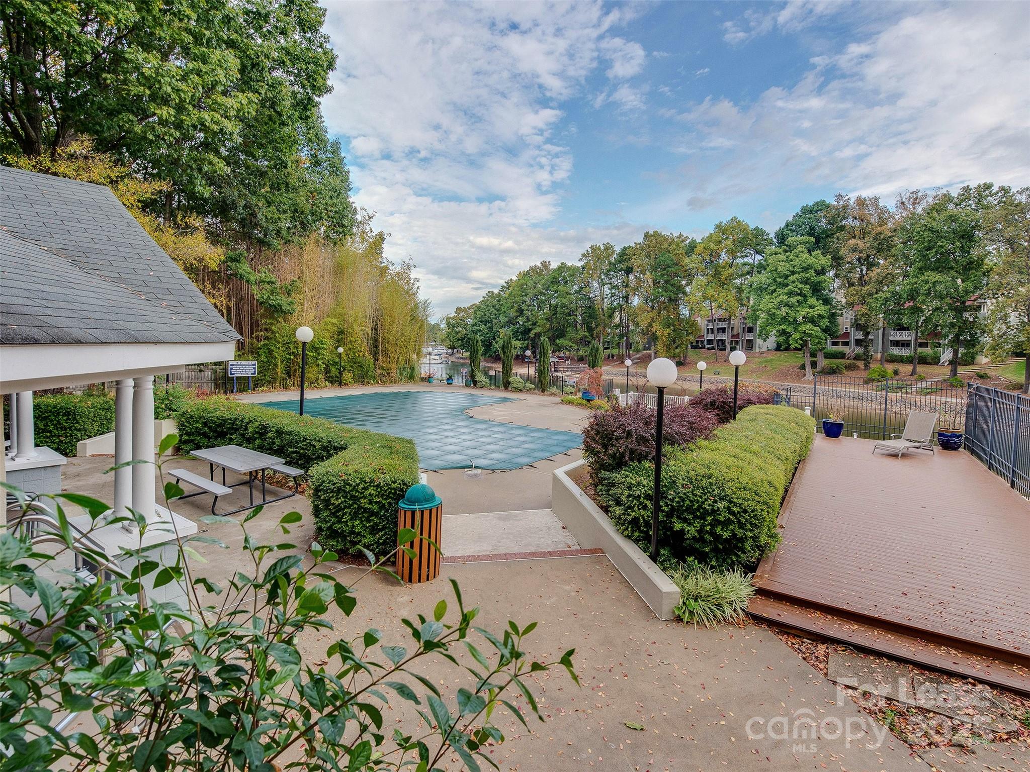 19827 Henderson Road, Unit B Cornelius, NC 28031 - Photo 45 of 48 a view of a garden with sitting area