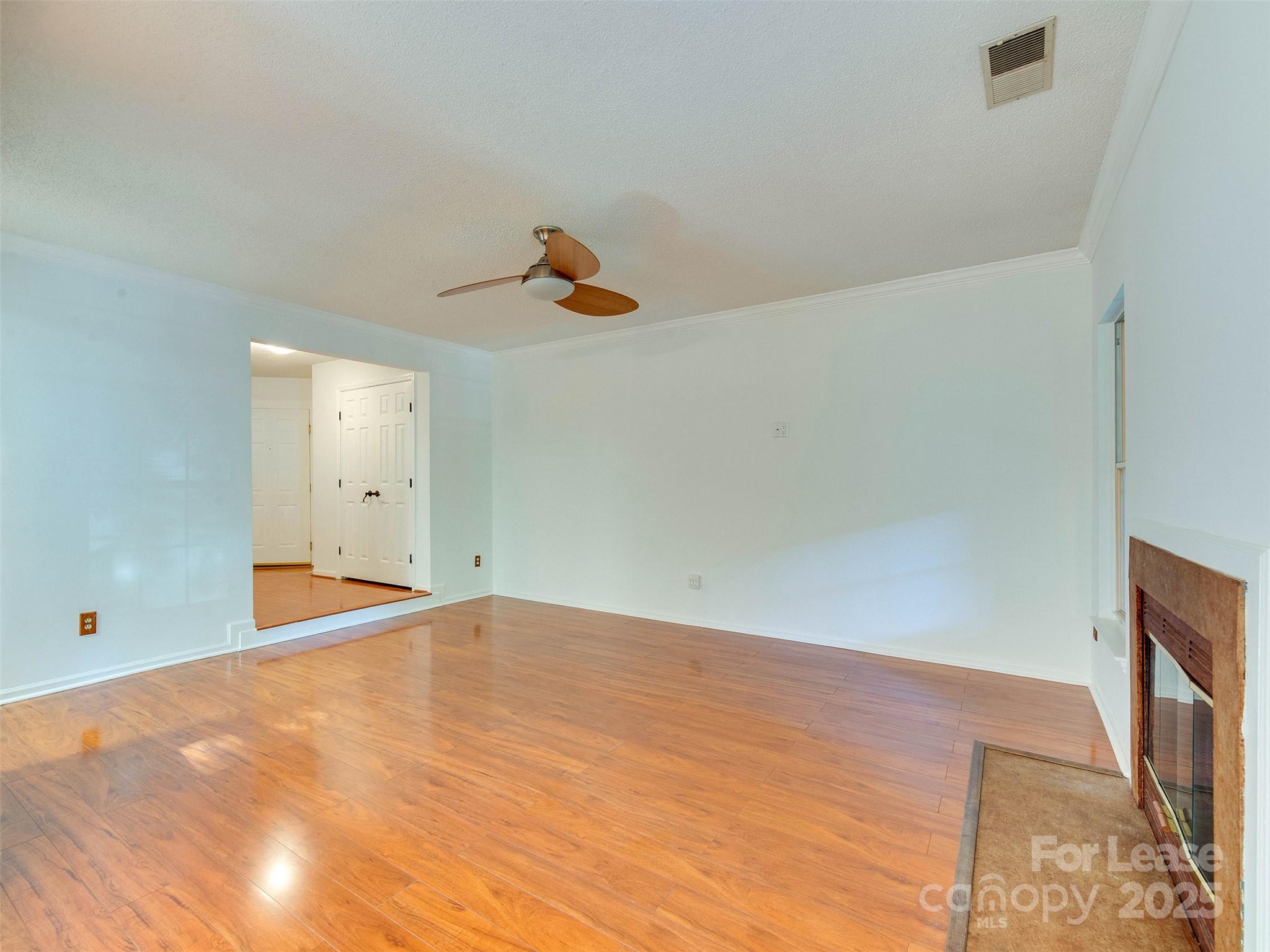 19827 Henderson Road, Unit B Cornelius, NC 28031 - Photo 9 of 48 a view of empty room with wooden floor