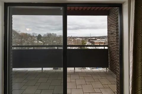 a view of balcony with furniture