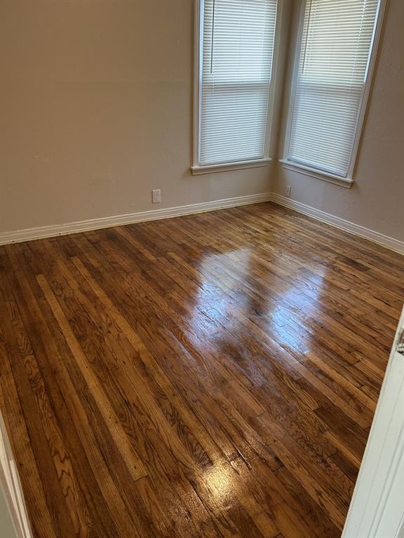 6318 Belgrade Avenue Dallas, TX 75227 - Photo 11 of 23 a view of room with window and wooden floor
