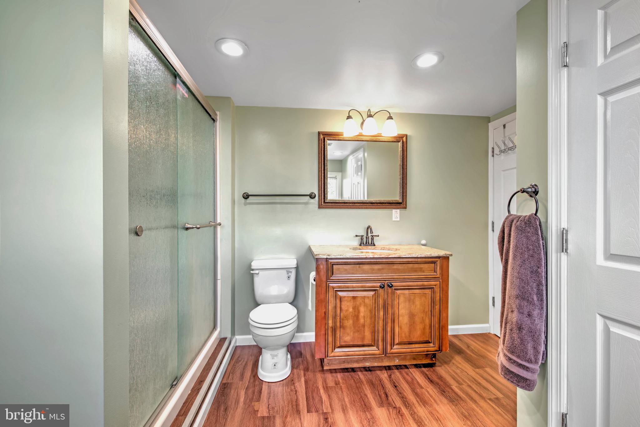 613 Howell Drive Westampton, NJ 08060 - Photo 12 of 18 a spacious bathroom with a toilet a sink and a mirror