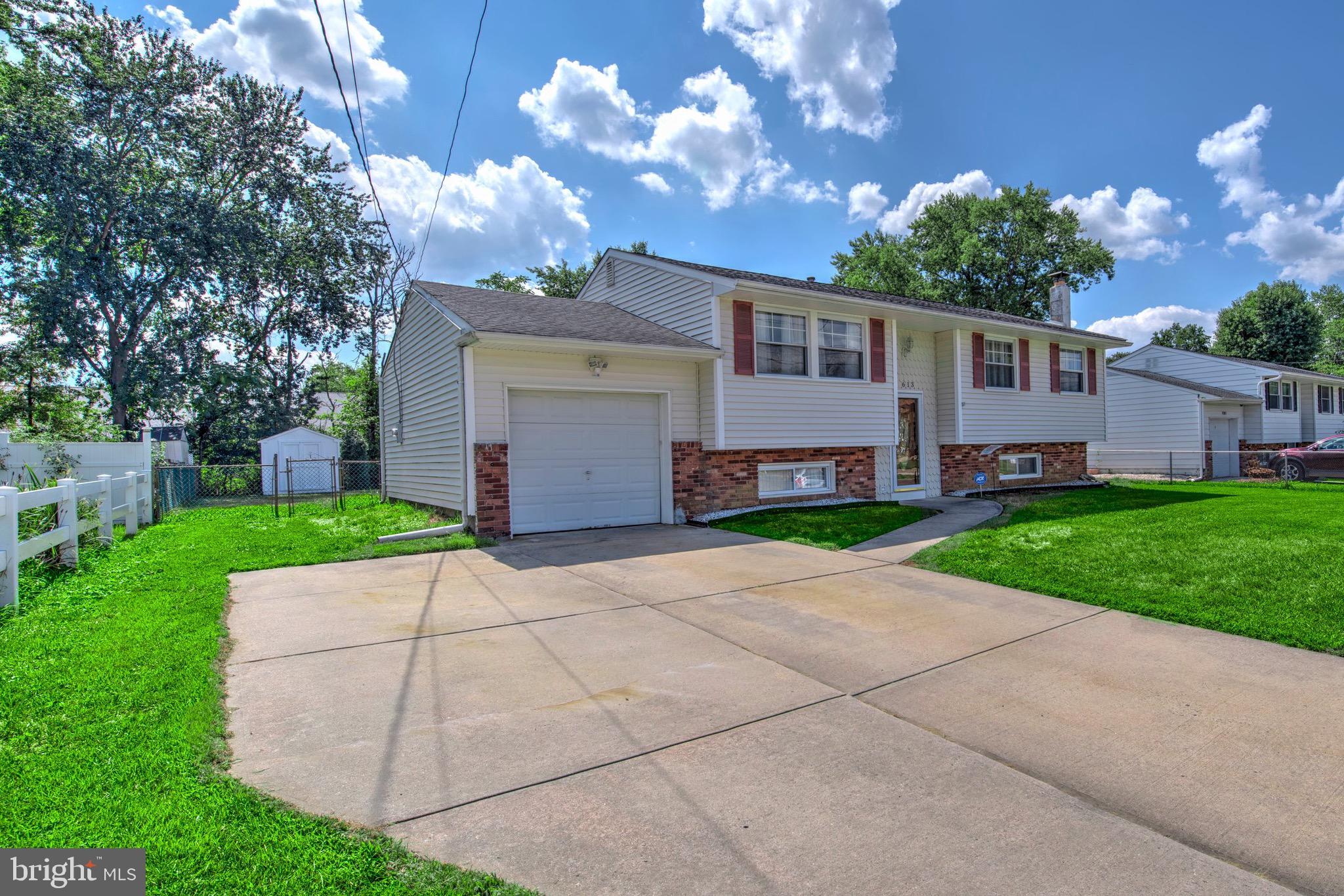 613 Howell Drive Westampton, NJ 08060 - Photo 17 of 18 a front view of house with yard and green space