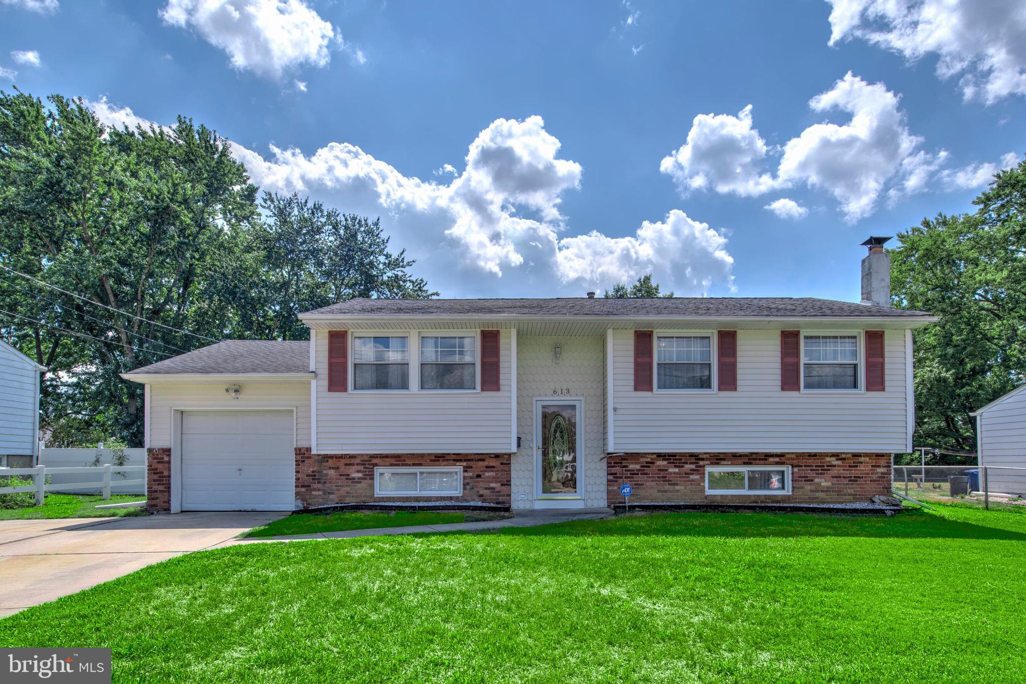 613 Howell Drive Westampton, NJ 08060 - Photo 18 of 18 a front view of a house with a garden