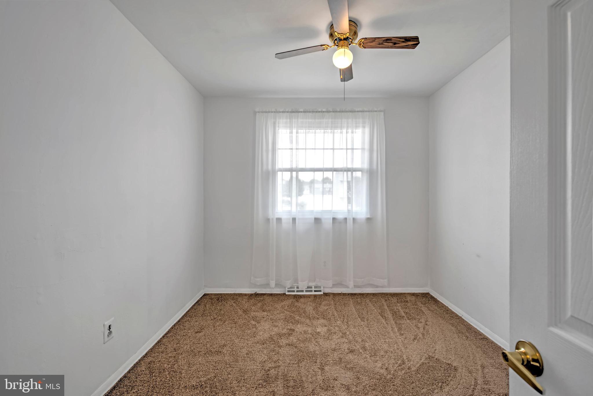 613 Howell Drive Westampton, NJ 08060 - Photo 6 of 18 an empty room with a window and a fan