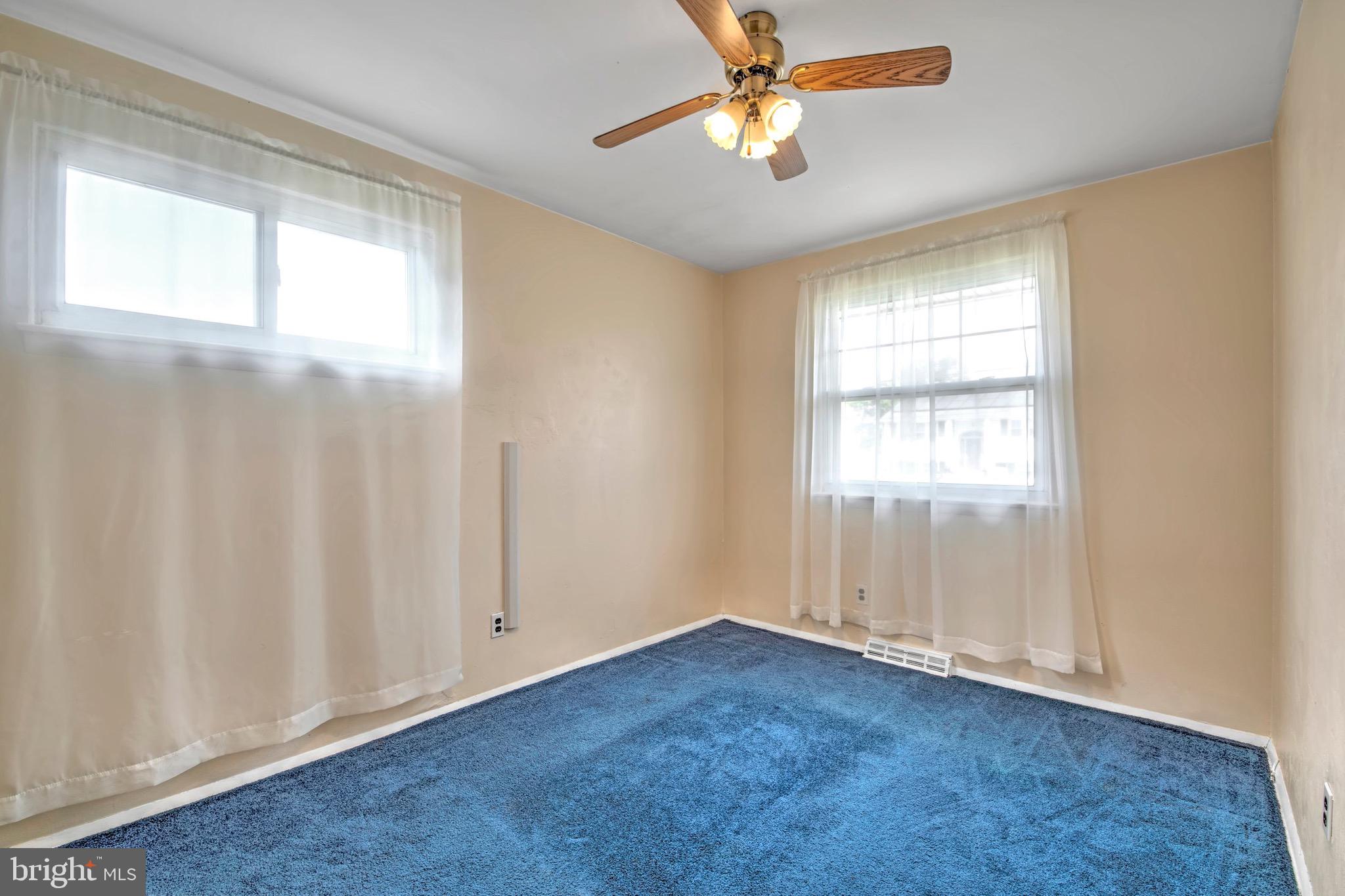613 Howell Drive Westampton, NJ 08060 - Photo 7 of 18 an empty room with windows and fan