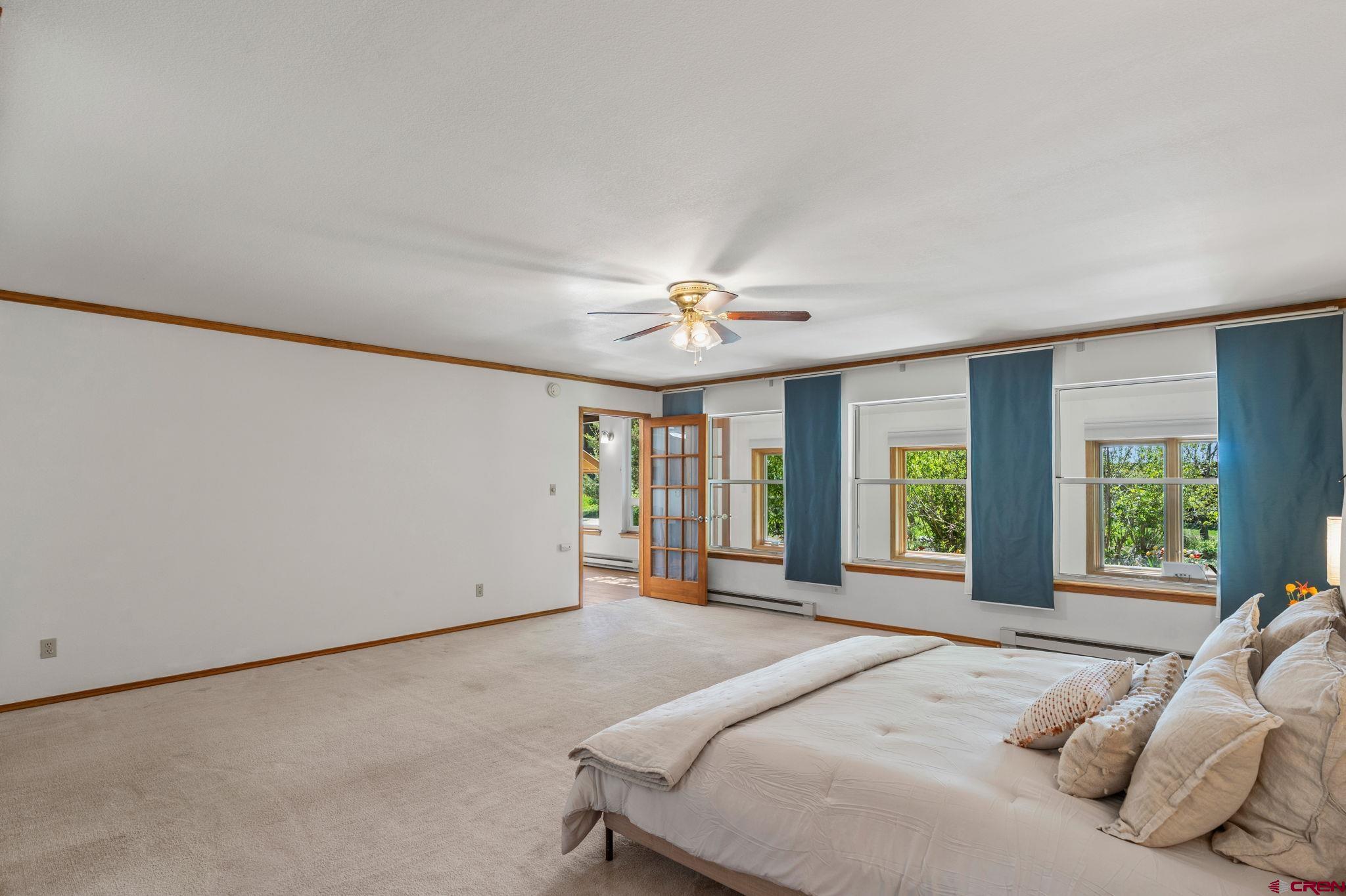 37 Verde Lane Durango, CO 81301 - Photo 17 of 45 a bedroom with a large bed and a large window