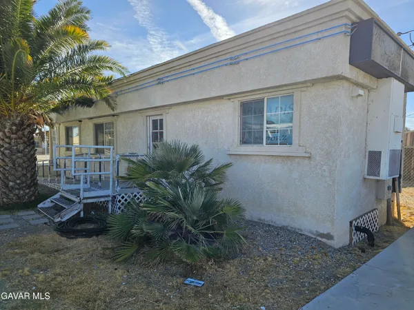 a view of backyard of a house