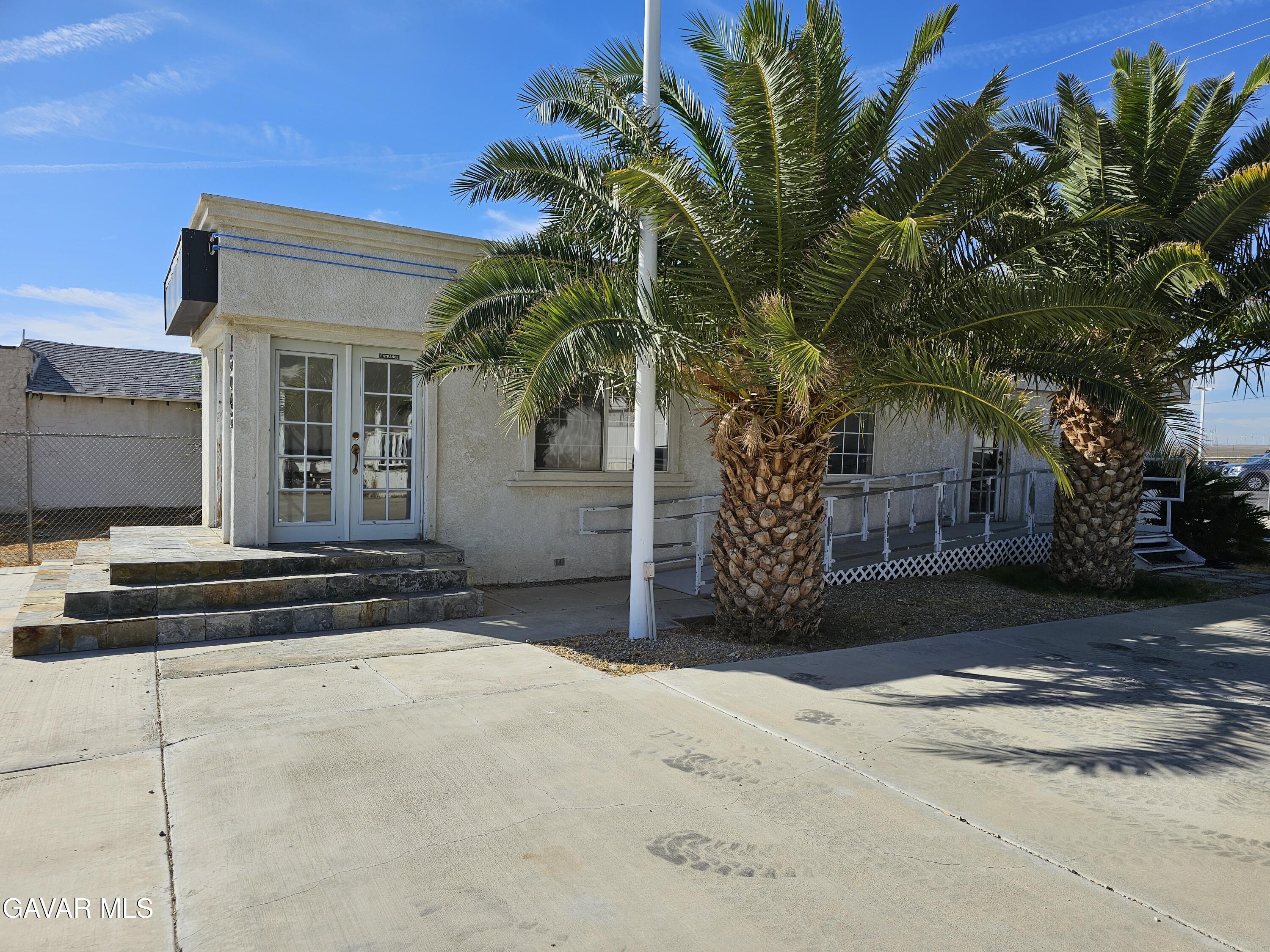 16043 K Street Mojave, CA 93501 - Photo 3 of 8 a view of a house with a yard