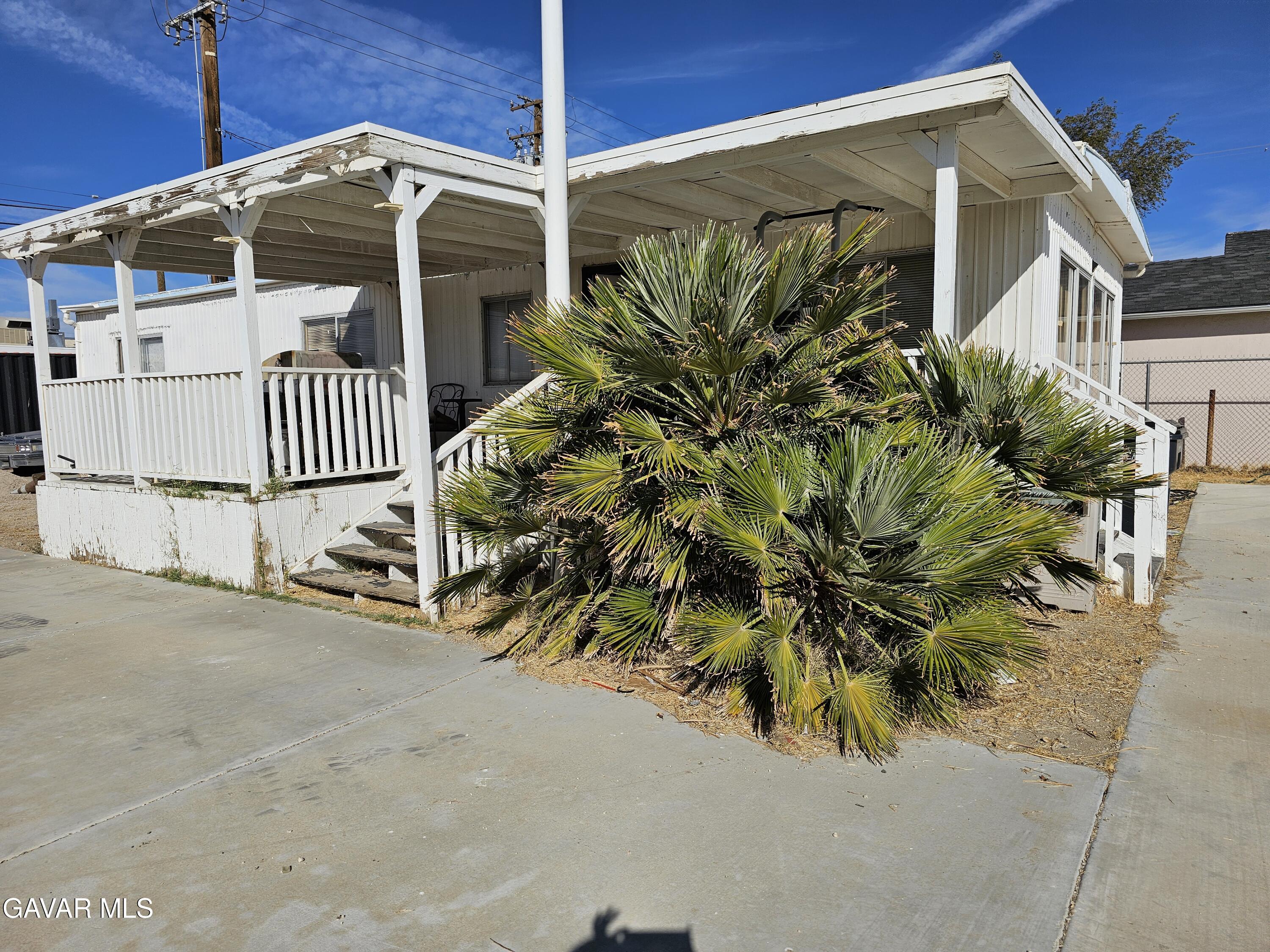16043 K Street Mojave, CA 93501 - Photo 6 of 8 a front view of a house with a yard