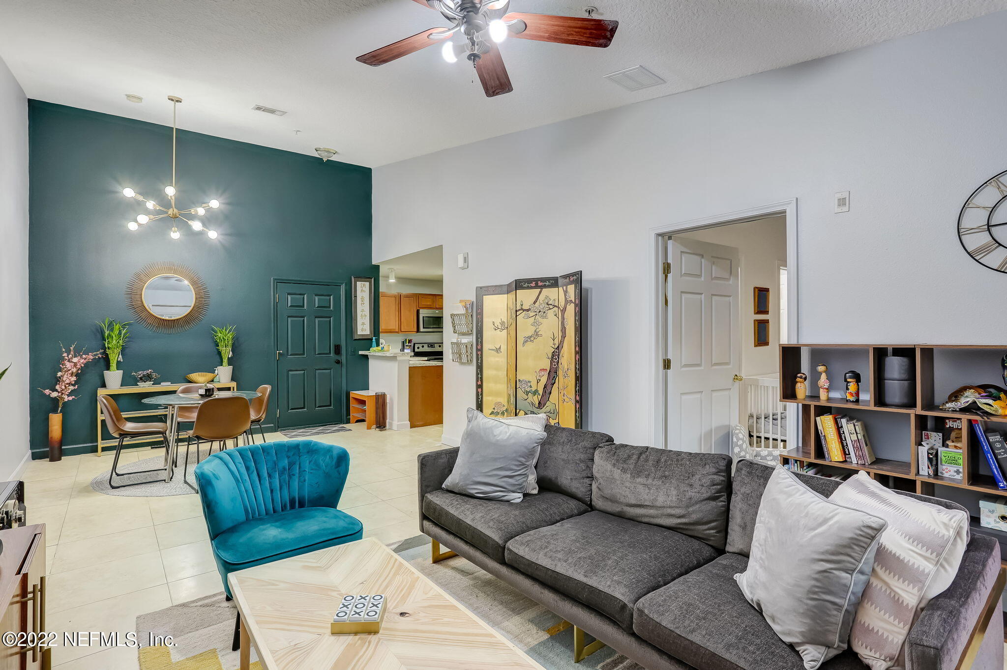 3690 Kirkpatrick Circle, Unit 710 Jacksonville, FL 32210 - Photo 11 of 34 a living room with furniture and a wooden floor