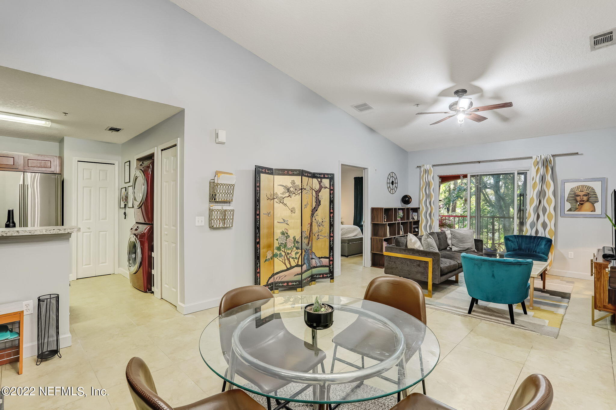 3690 Kirkpatrick Circle, Unit 710 Jacksonville, FL 32210 - Photo 13 of 34 a living room with furniture and a large window