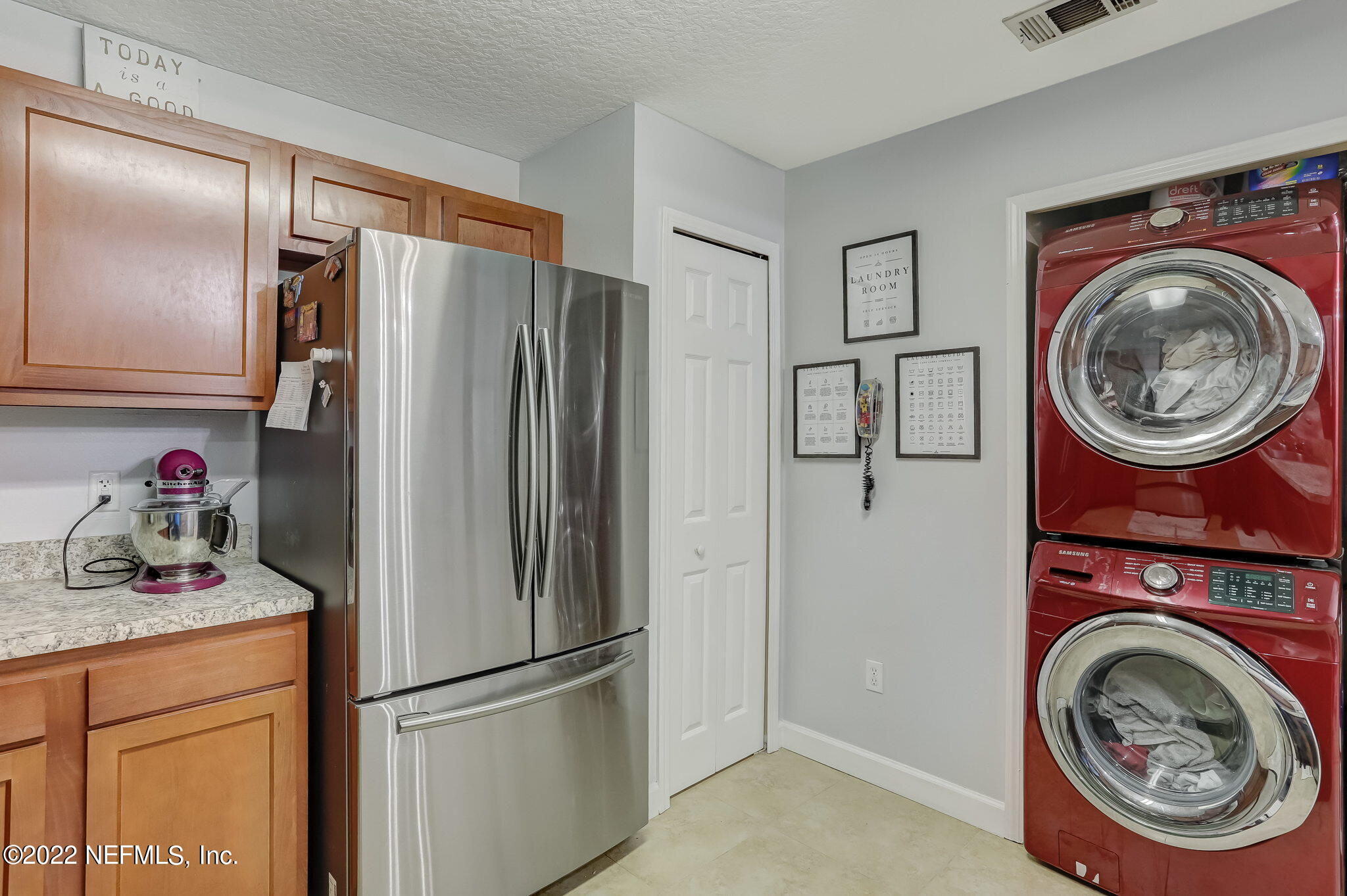 3690 Kirkpatrick Circle, Unit 710 Jacksonville, FL 32210 - Photo 16 of 34 a kitchen with stainless steel appliances granite countertop a refrigerator and a stove top oven