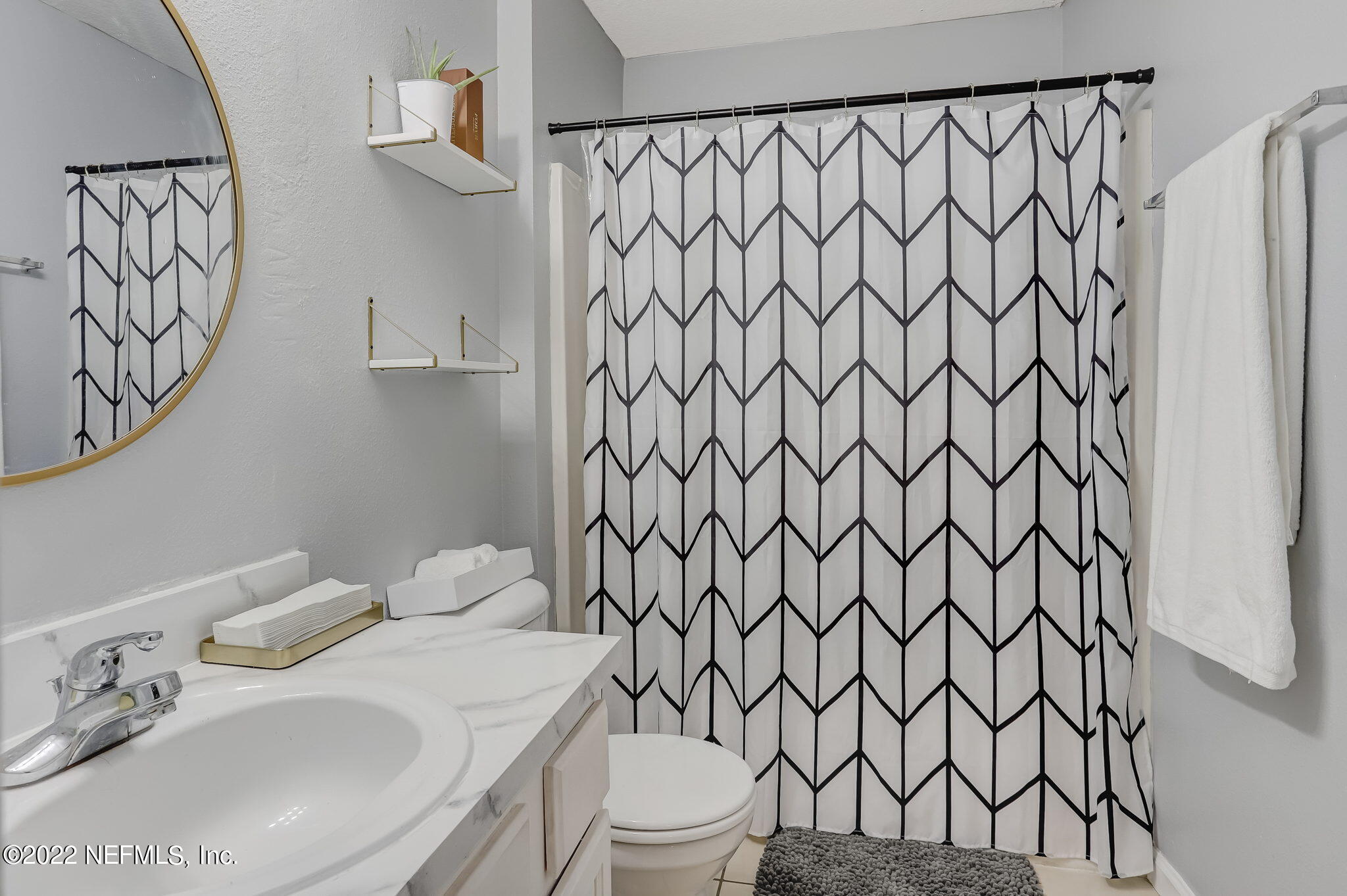 3690 Kirkpatrick Circle, Unit 710 Jacksonville, FL 32210 - Photo 22 of 34 a bathroom with a sink and a toilet