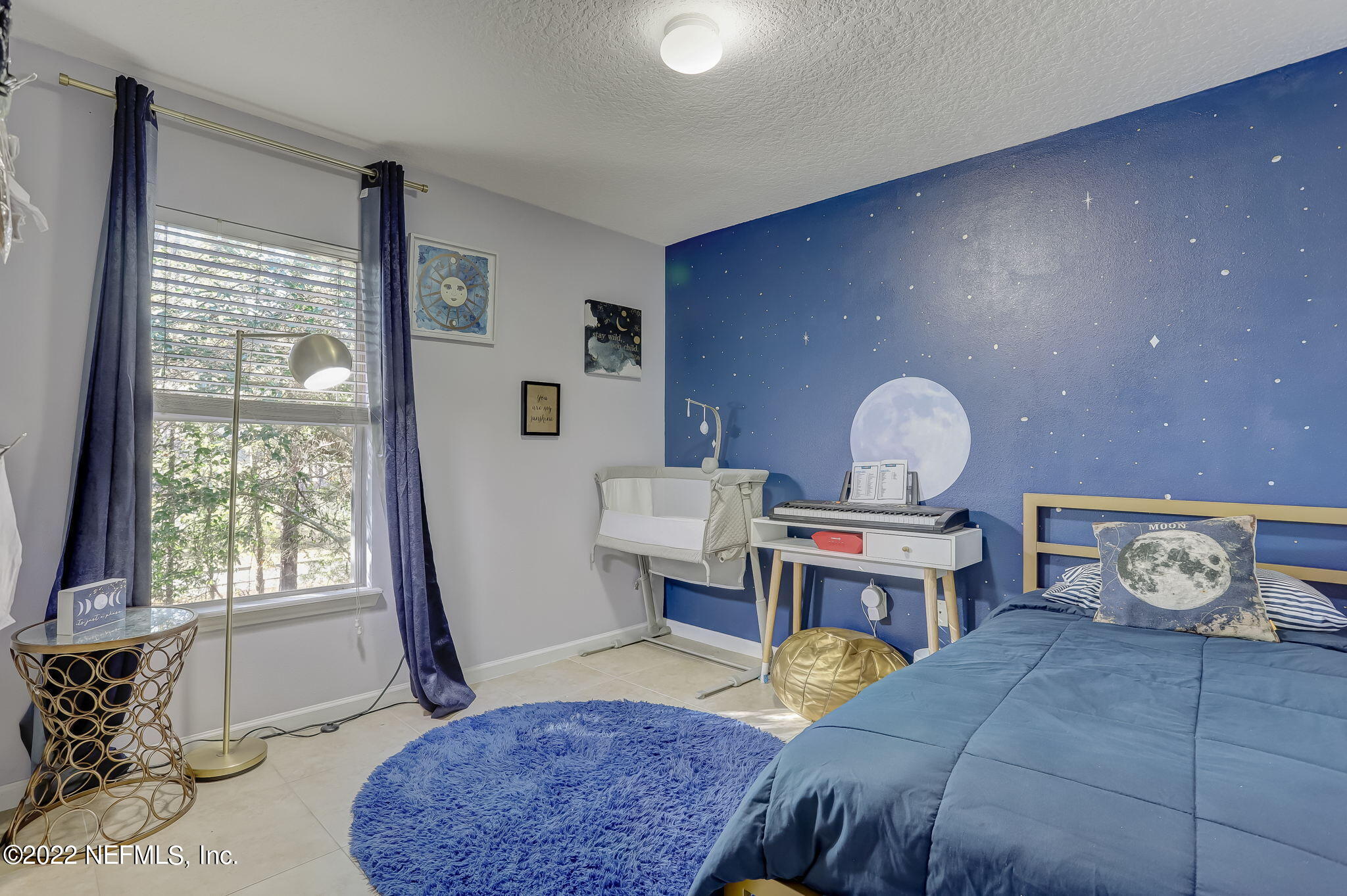 3690 Kirkpatrick Circle, Unit 710 Jacksonville, FL 32210 - Photo 28 of 34 a bedroom with a bed and wooden floor