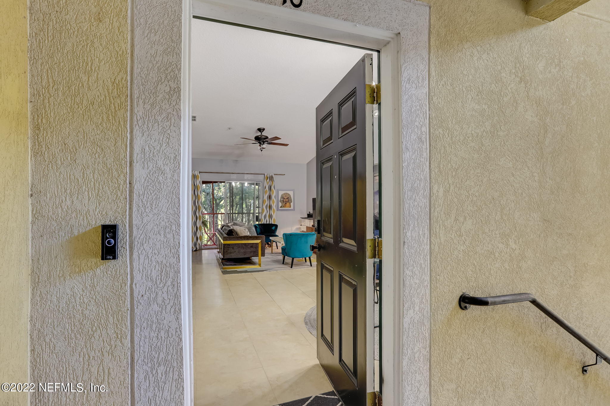 3690 Kirkpatrick Circle, Unit 710 Jacksonville, FL 32210 - Photo 7 of 34 a view of a hallway with living room and dining room