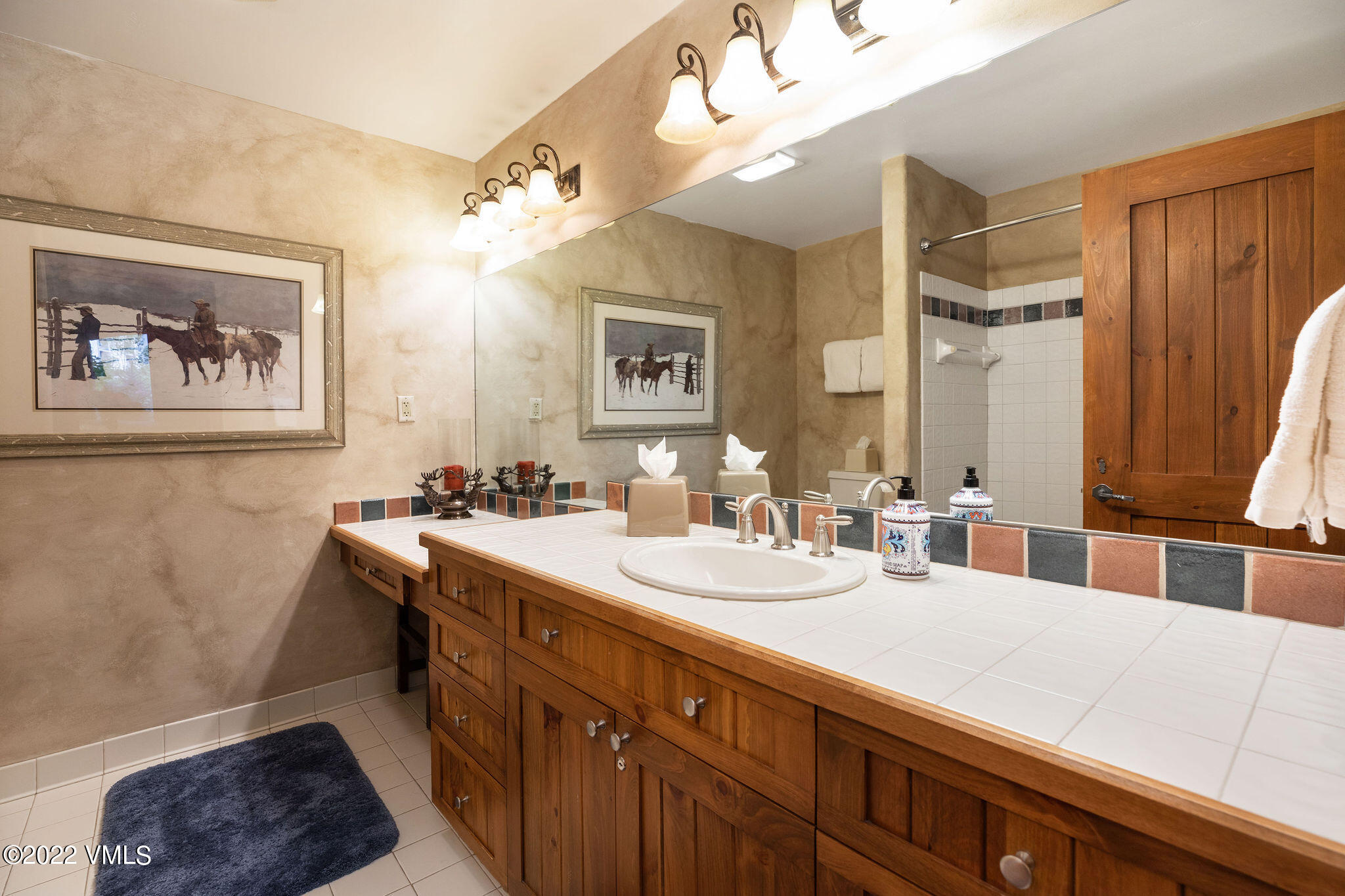 51 Offerson Road, Unit 114 Beaver Creek, CO 81620 - Photo 18 of 30 a bathroom with a double vanity sink mirror and double