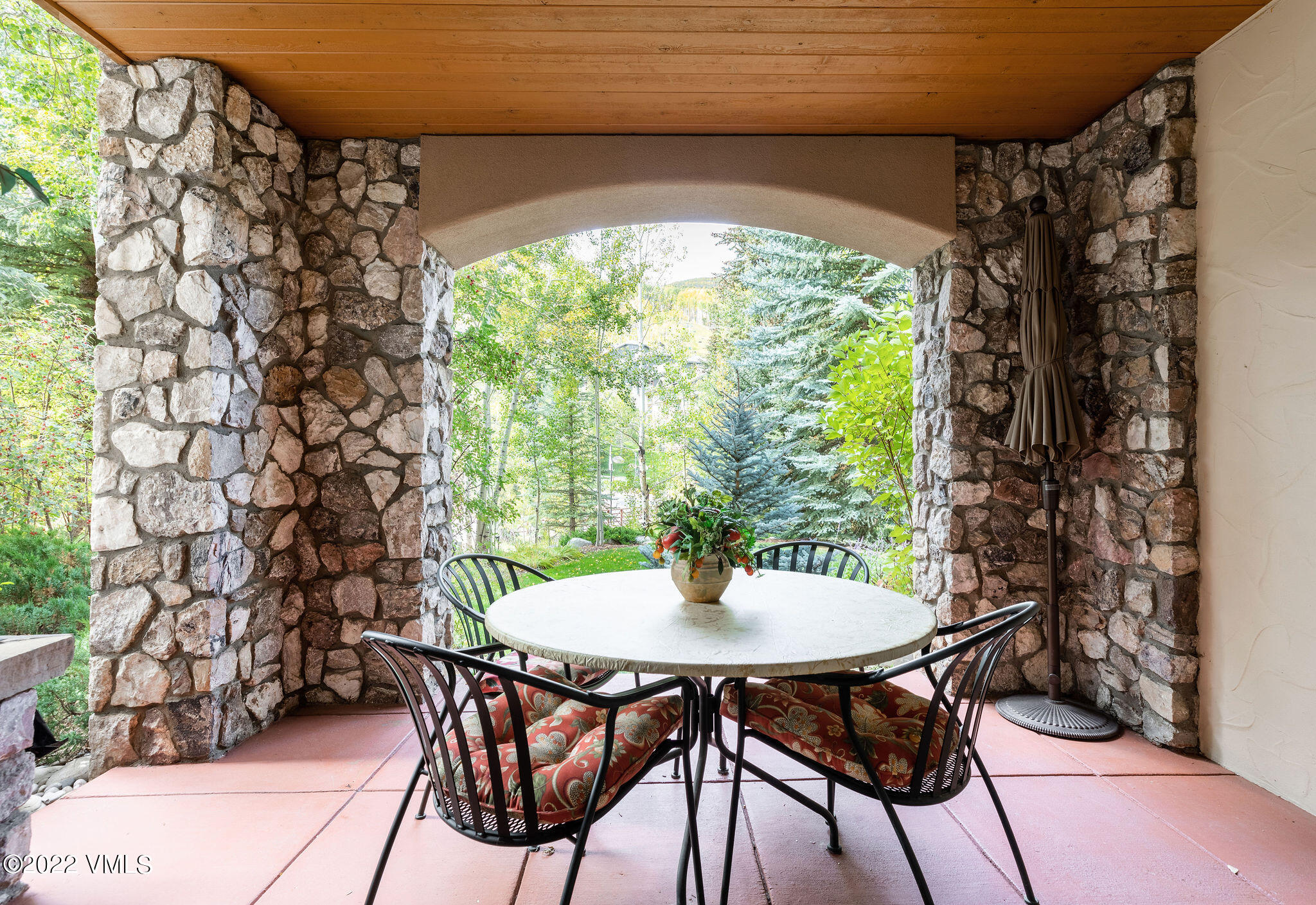 51 Offerson Road, Unit 114 Beaver Creek, CO 81620 - Photo 19 of 30 a table and chairs in a patio