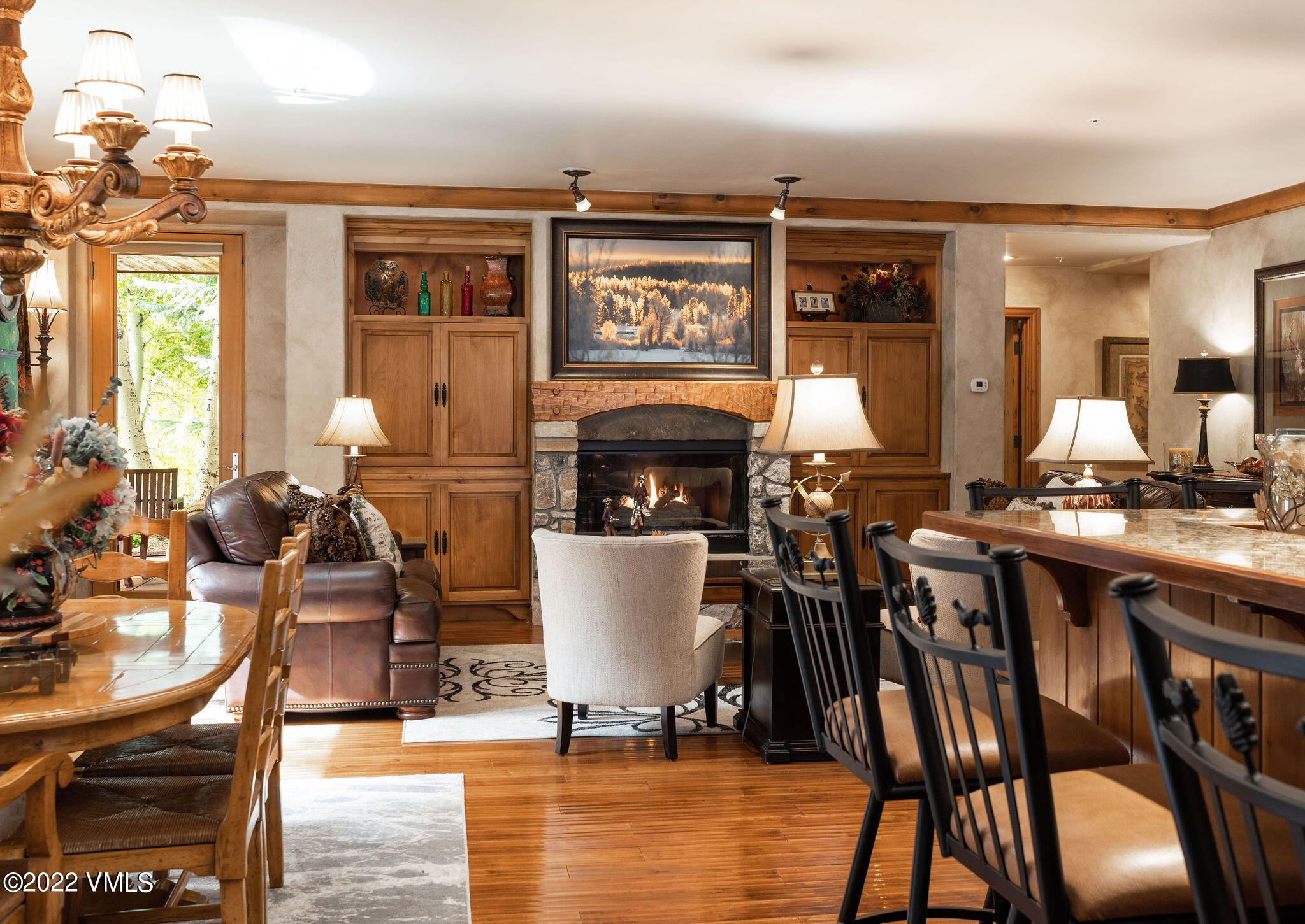 51 Offerson Road, Unit 114 Beaver Creek, CO 81620 - Photo 2 of 30 a living room with couches a fireplace with wooden floor
