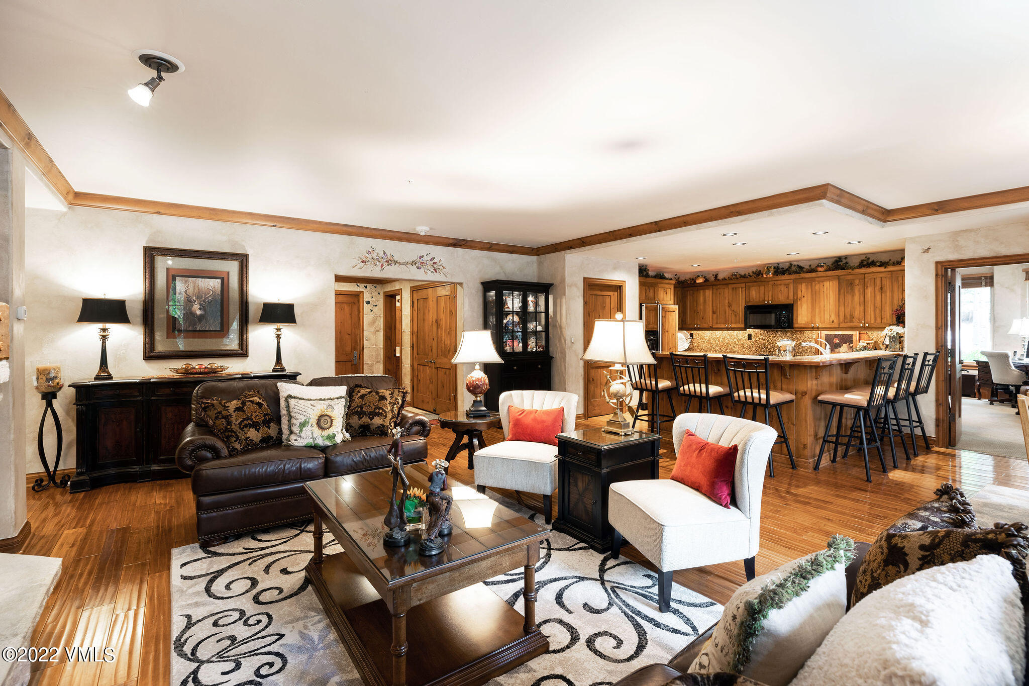 51 Offerson Road, Unit 114 Beaver Creek, CO 81620 - Photo 5 of 30 a living room with furniture and a wooden floor