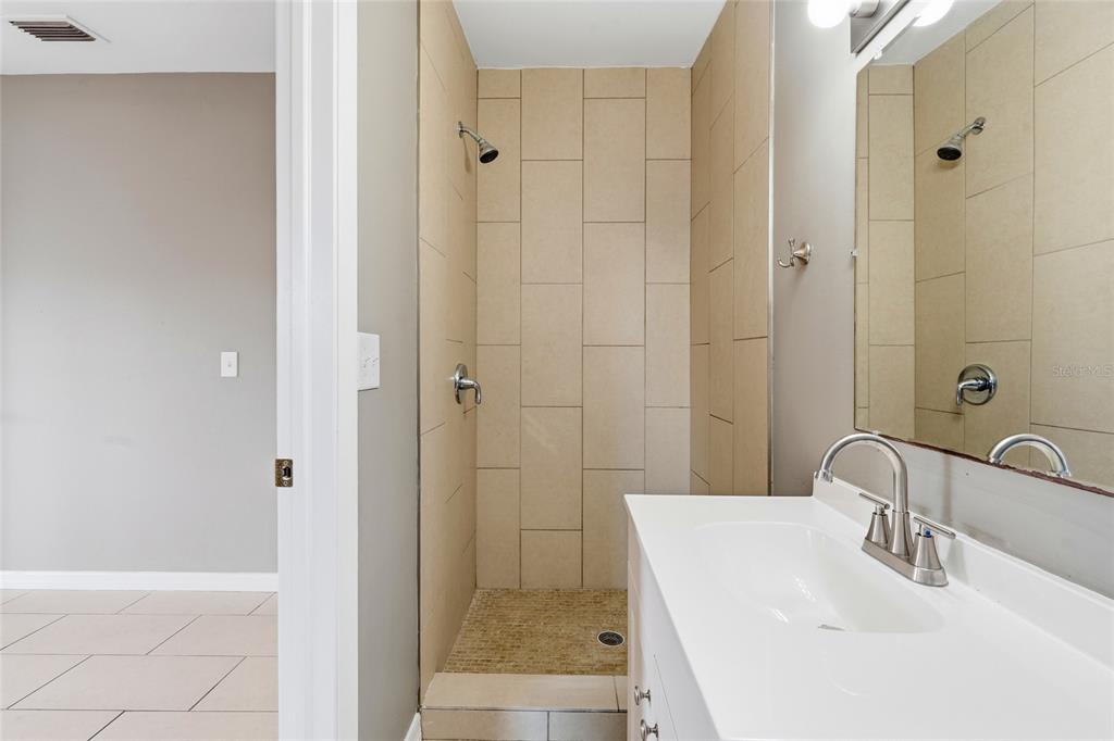 363 Glen Oak Road Venice, FL 34293 - Photo 34 of 53 a bathroom with a sink and a mirror