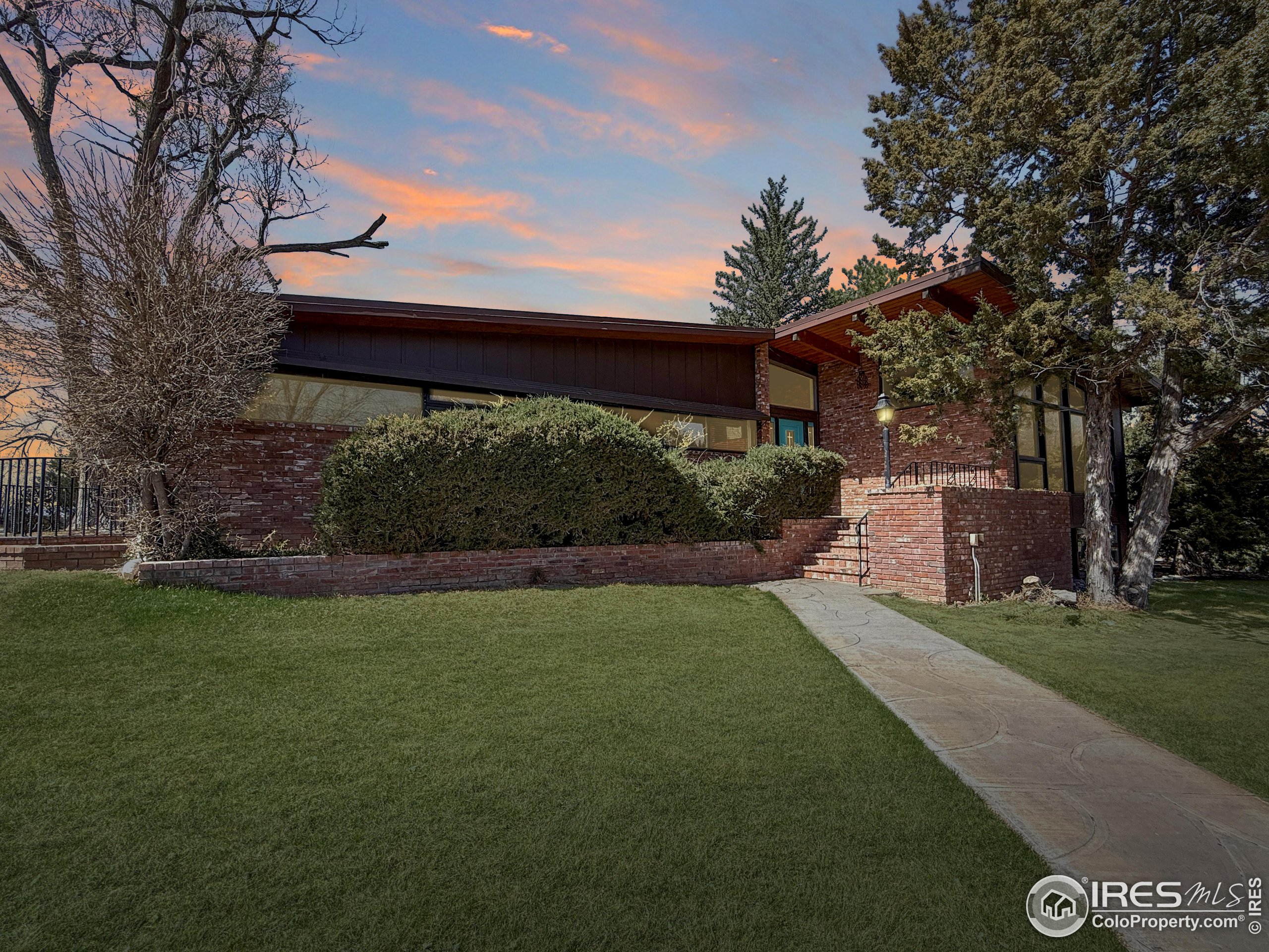 13302 County Road Sterling, CO 80751 - Photo 3 of 40 a view of a backyard with a garden