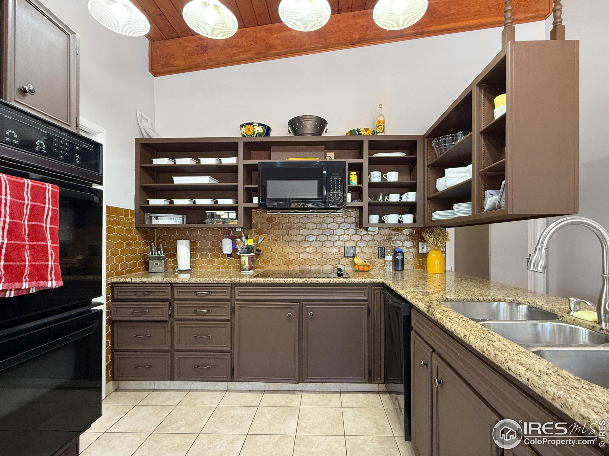 13302 County Road Sterling, CO 80751 - Photo 8 of 40 a kitchen with a sink and cabinets