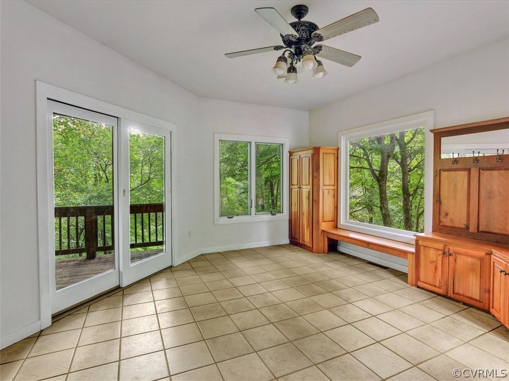 7461 Pine Ridge Road Mechanicsville, VA 23116 - Photo 16 of 42 a view of a livingroom with a large window chandelier fan