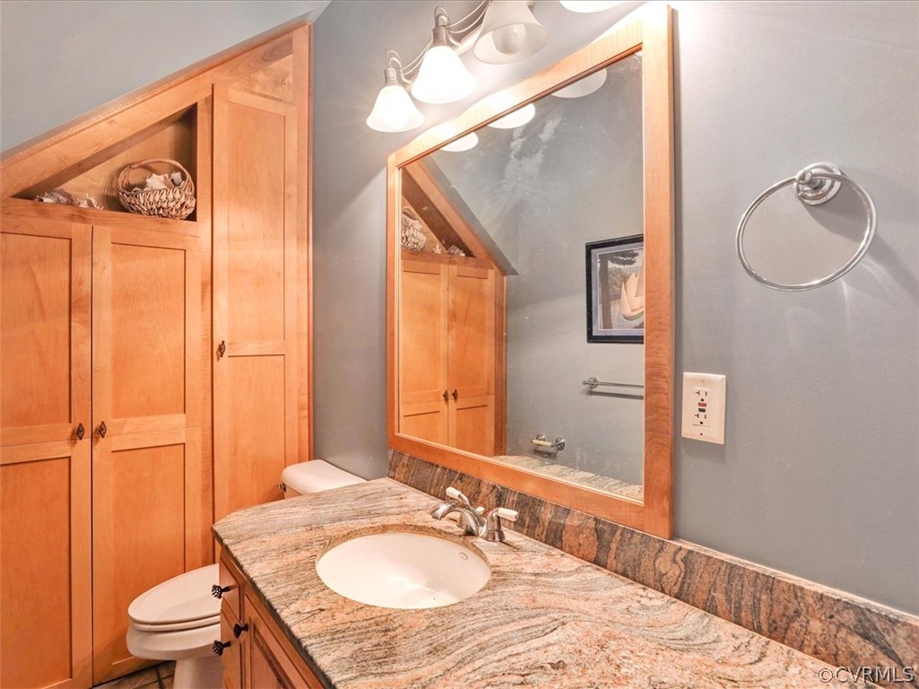 7461 Pine Ridge Road Mechanicsville, VA 23116 - Photo 20 of 42 a bathroom with a granite countertop sink toilet and shower