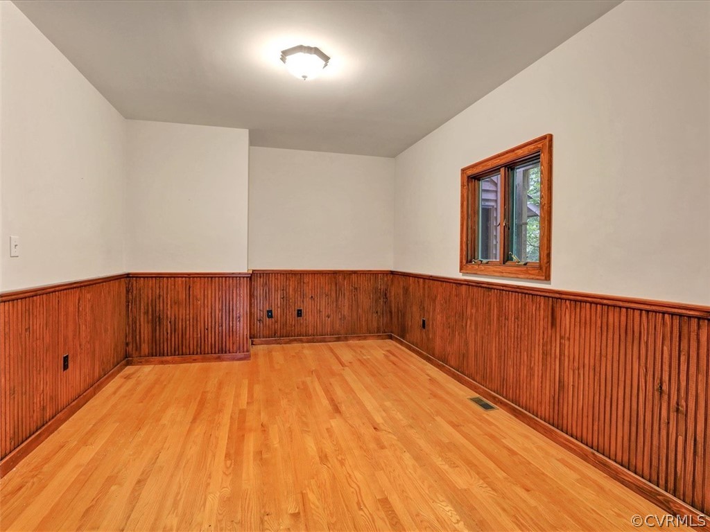 7461 Pine Ridge Road Mechanicsville, VA 23116 - Photo 22 of 42 a view of a room with wooden floor and brick walls