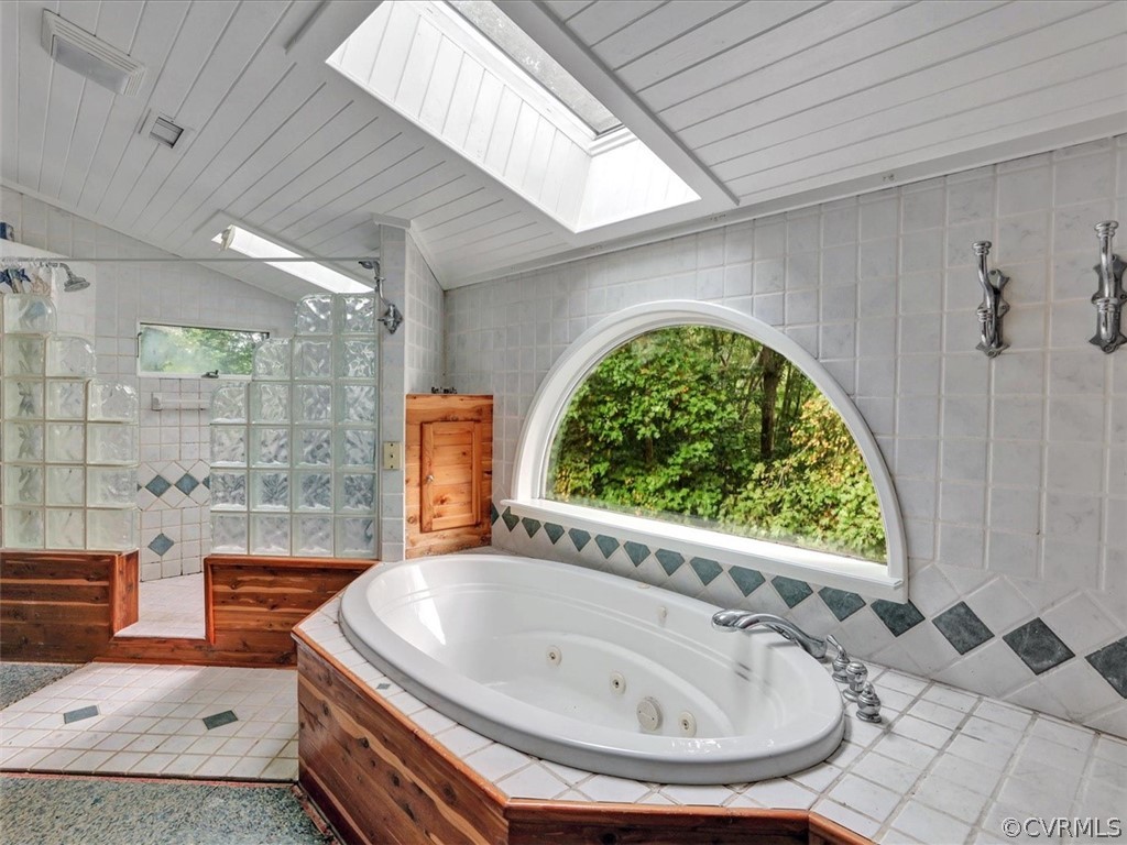 7461 Pine Ridge Road Mechanicsville, VA 23116 - Photo 29 of 42 a bath tub sitting in a bathroom next to a window