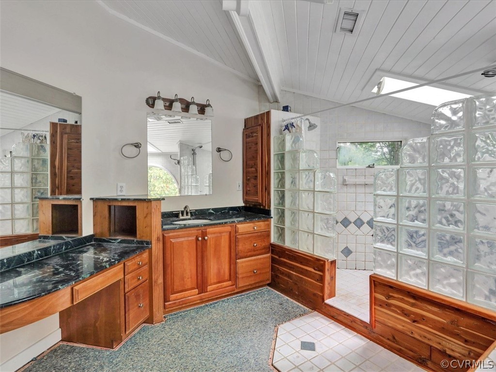 7461 Pine Ridge Road Mechanicsville, VA 23116 - Photo 30 of 42 a spacious bathroom with stainless steel appliances granite countertop a sink and a shower
