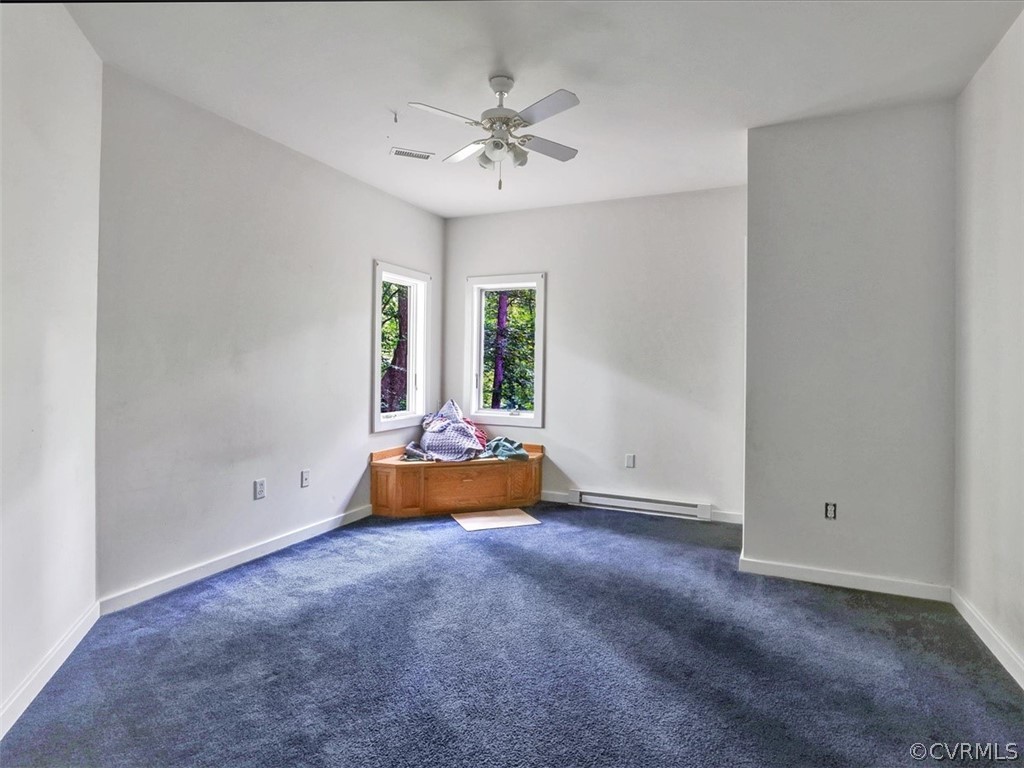 7461 Pine Ridge Road Mechanicsville, VA 23116 - Photo 35 of 42 an empty room with closet and fan
