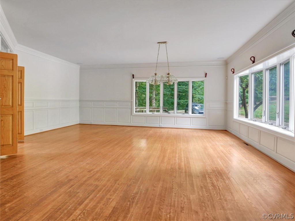 7461 Pine Ridge Road Mechanicsville, VA 23116 - Photo 7 of 42 an empty room with wooden floor and windows