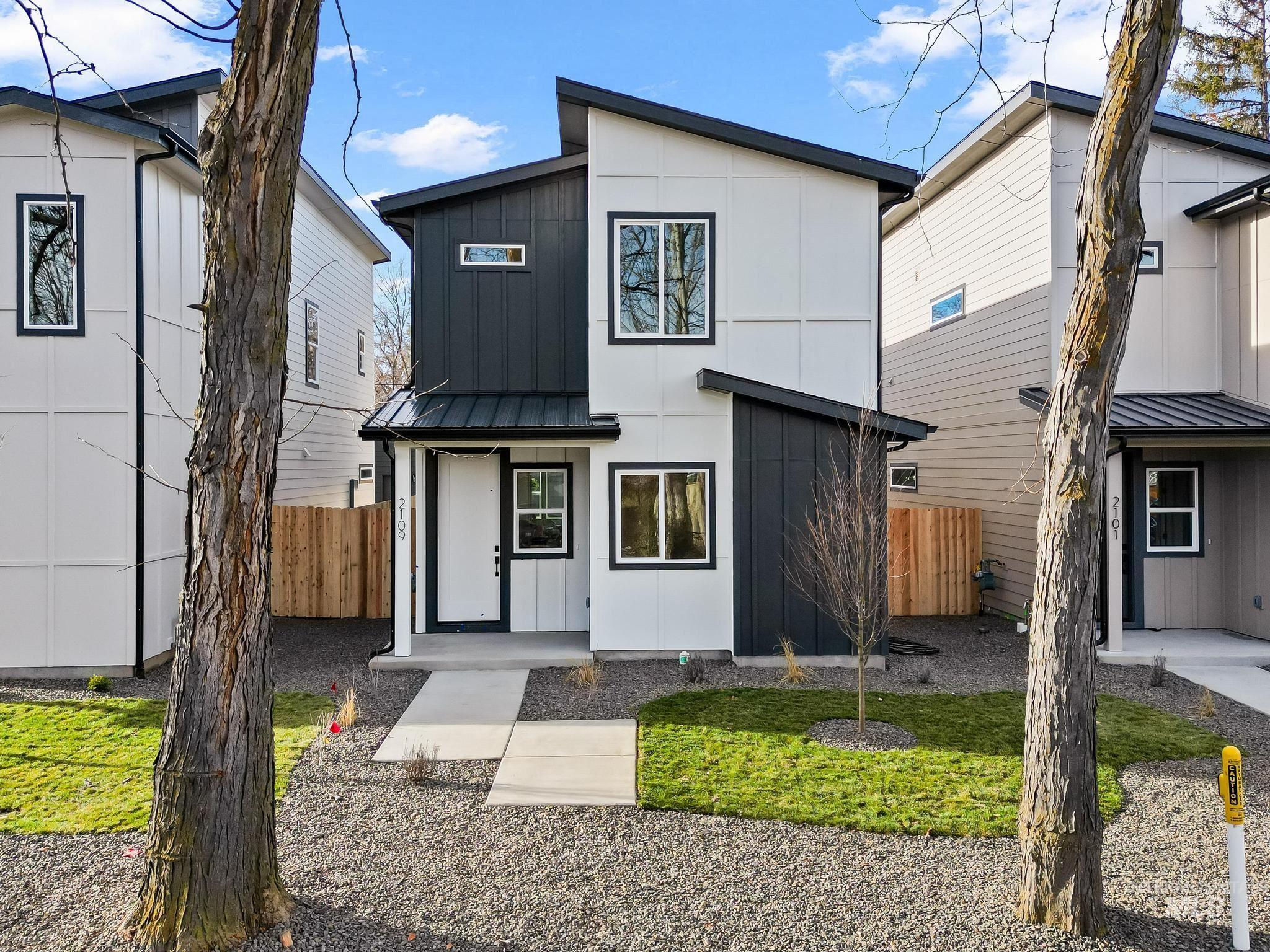 View of front of home featuring a metal roof, board and batten siding, and a standing seam roof