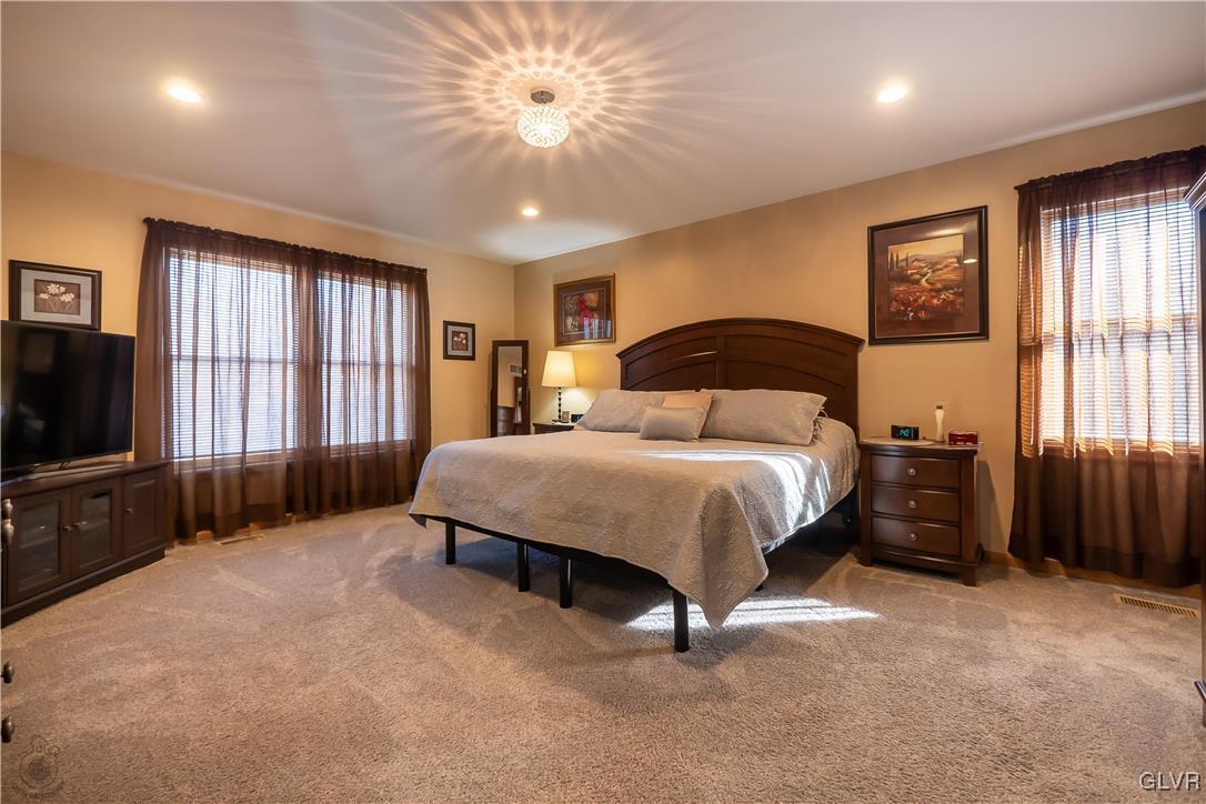 110 Deer Run Road Stroudsburg, PA 18360 - Photo 17 of 50 a spacious bedroom with a bed and a tv on dresser