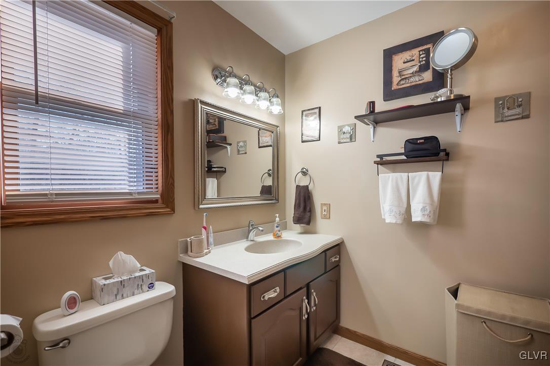 110 Deer Run Road Stroudsburg, PA 18360 - Photo 20 of 50 a bathroom with a toilet sink and mirror