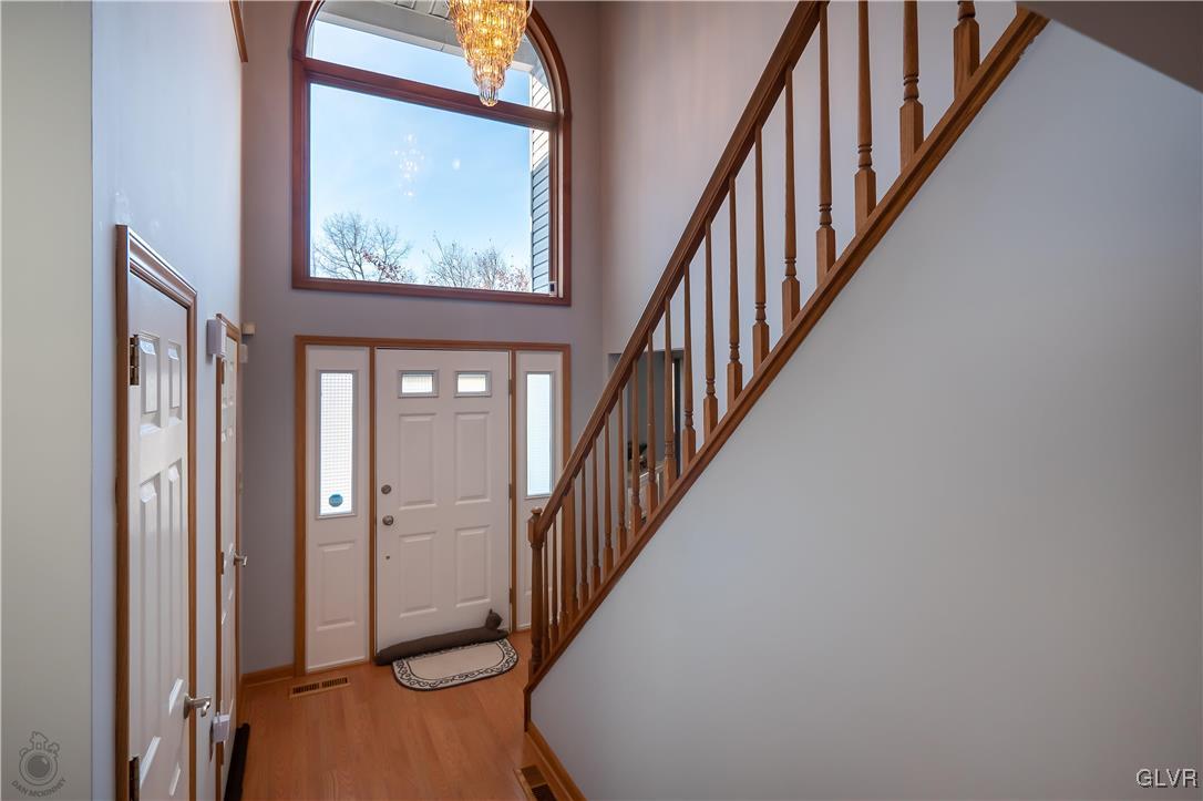 110 Deer Run Road Stroudsburg, PA 18360 - Photo 2 of 50 a view of staircase with wooden floor and a large window