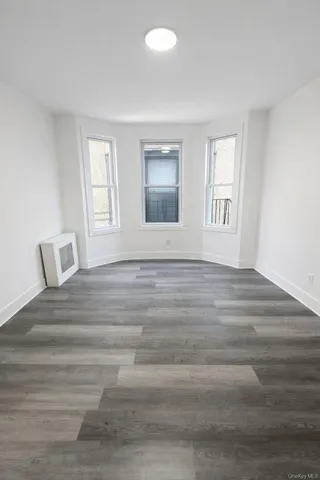 a bathroom with a double vanity sink toilet and shower