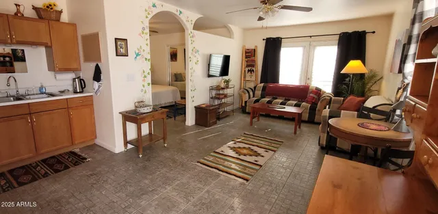 a living room with furniture and a table