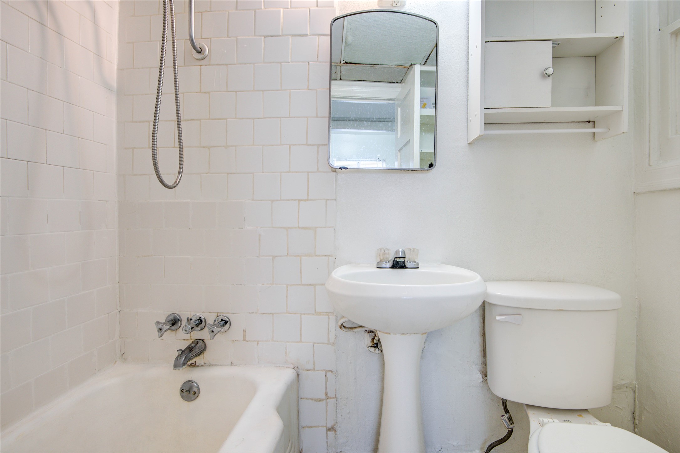 1828 West Main Street, Unit 1 Houston, TX 77098 - Photo 14 of 20 a bathroom with a sink mirror toilet and bathtub
