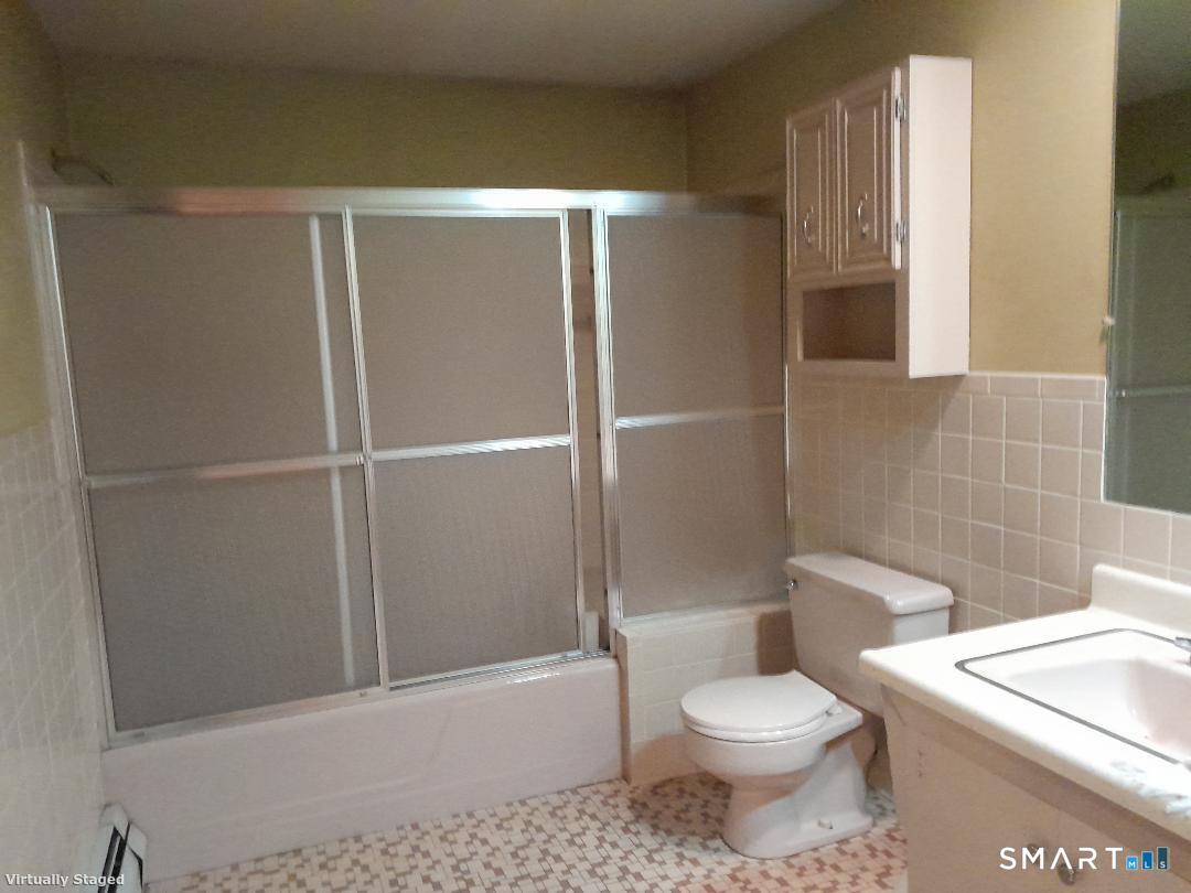 385 Cotton Hill Road New Hartford, CT 06057 - Photo 16 of 17 a white toilet sitting next to a bath tub