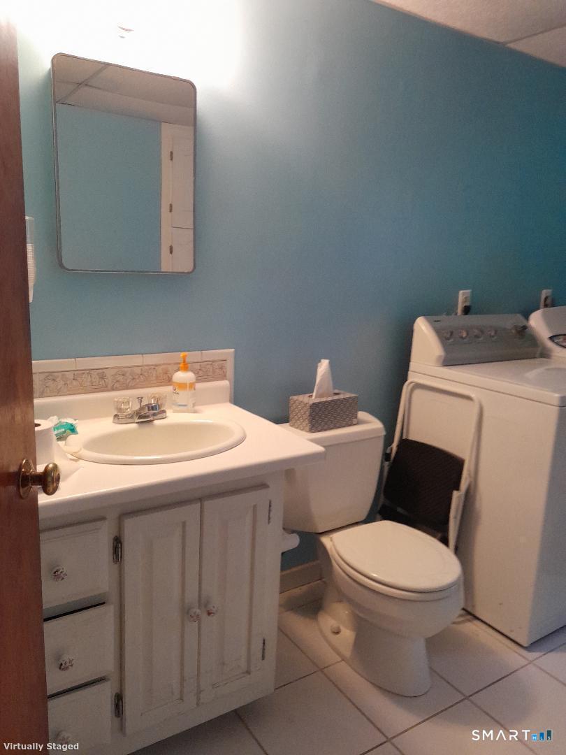 385 Cotton Hill Road New Hartford, CT 06057 - Photo 17 of 17 a bathroom with a toilet sink and mirror