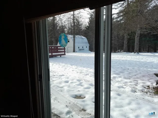 a view of a glass door with a yard