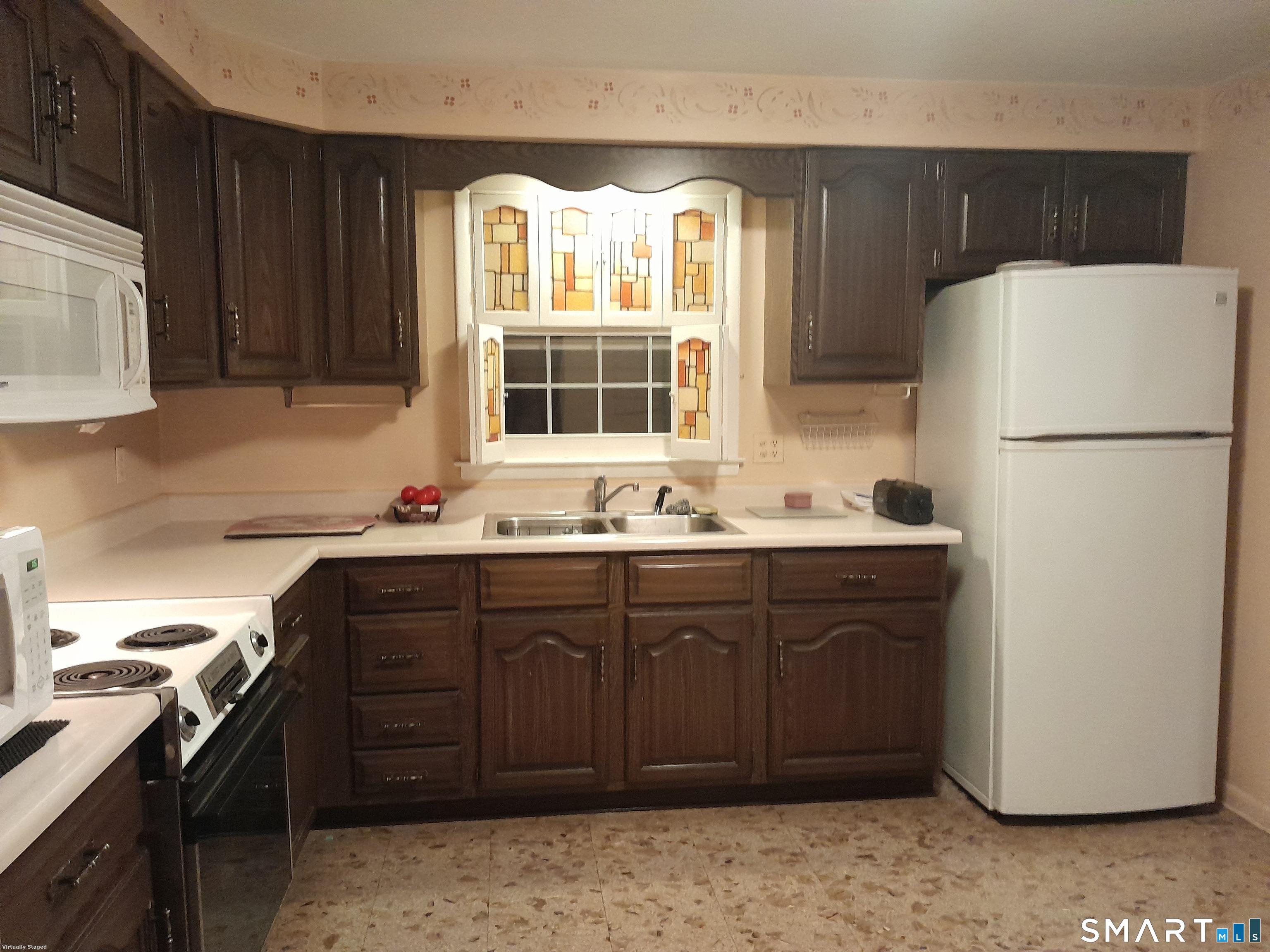 385 Cotton Hill Road New Hartford, CT 06057 - Photo 10 of 17 a kitchen with a sink and a refrigerator