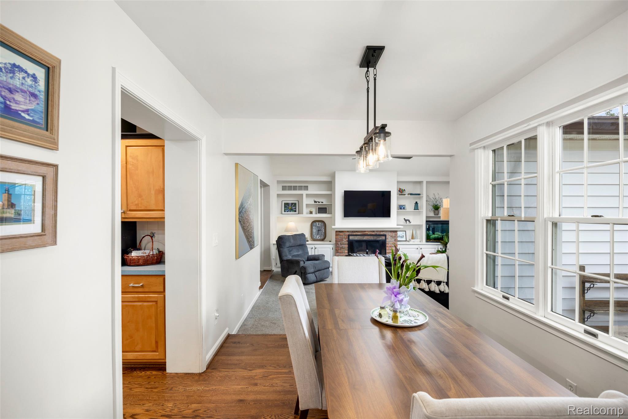 244 Kerby Road Grosse Pointe, MI 48236 - Photo 4 of 53 Dining room featuring dark wood-style flooring and a fireplace