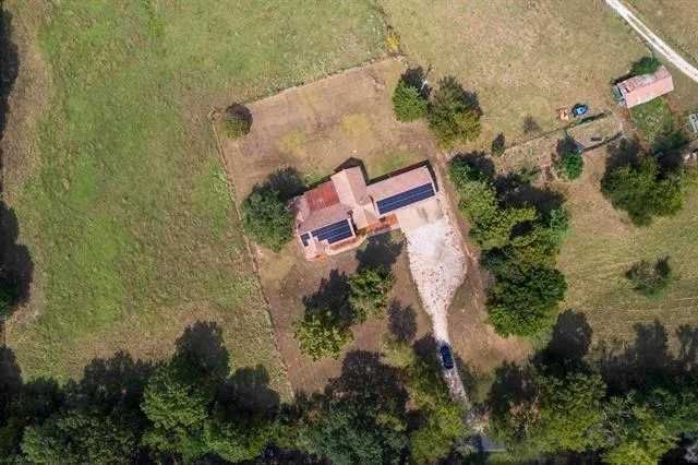 an aerial view of houses with yard