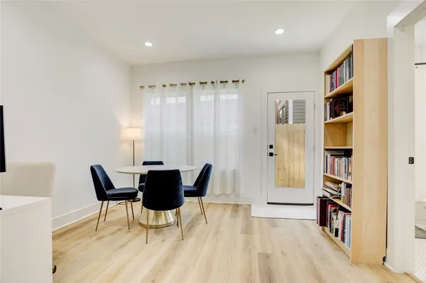 a view of a livingroom with furniture and front door